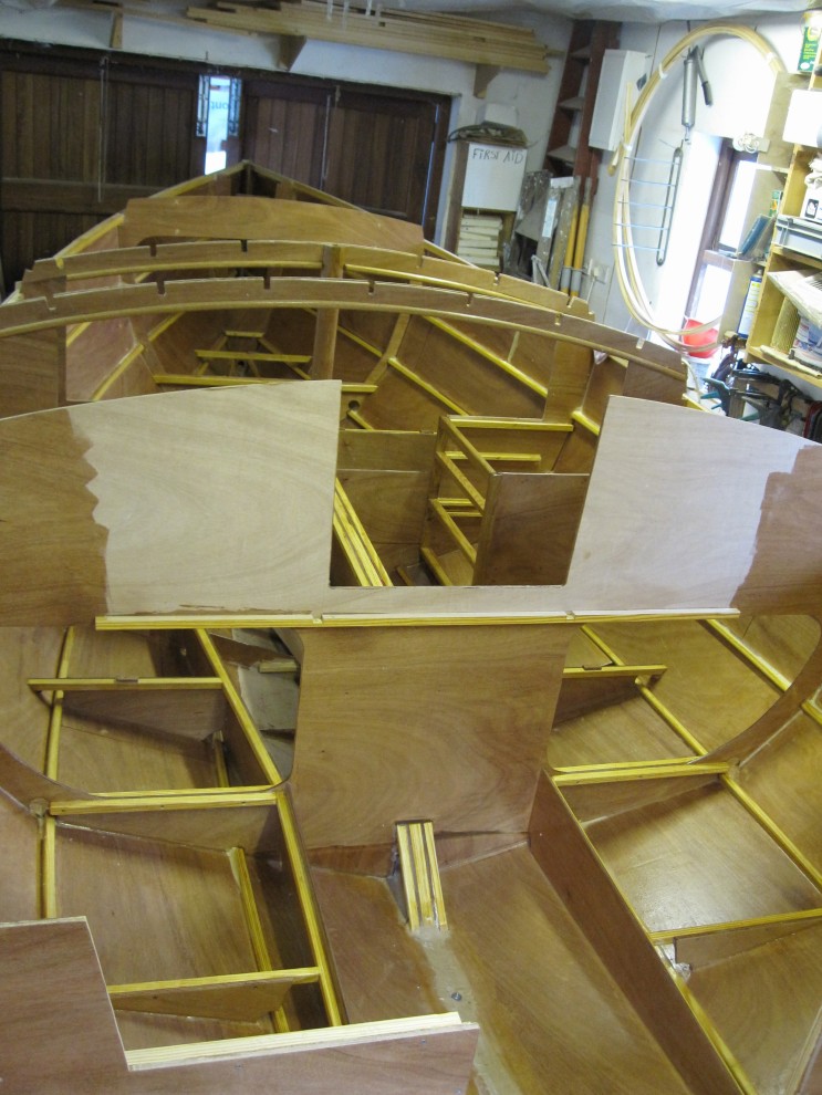Epoxy coating and painting interior of 21′ Cape Henry Gaff 